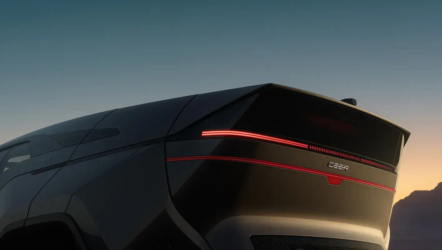 The CEER SUV's red rear light bar glowing against a dusk sky