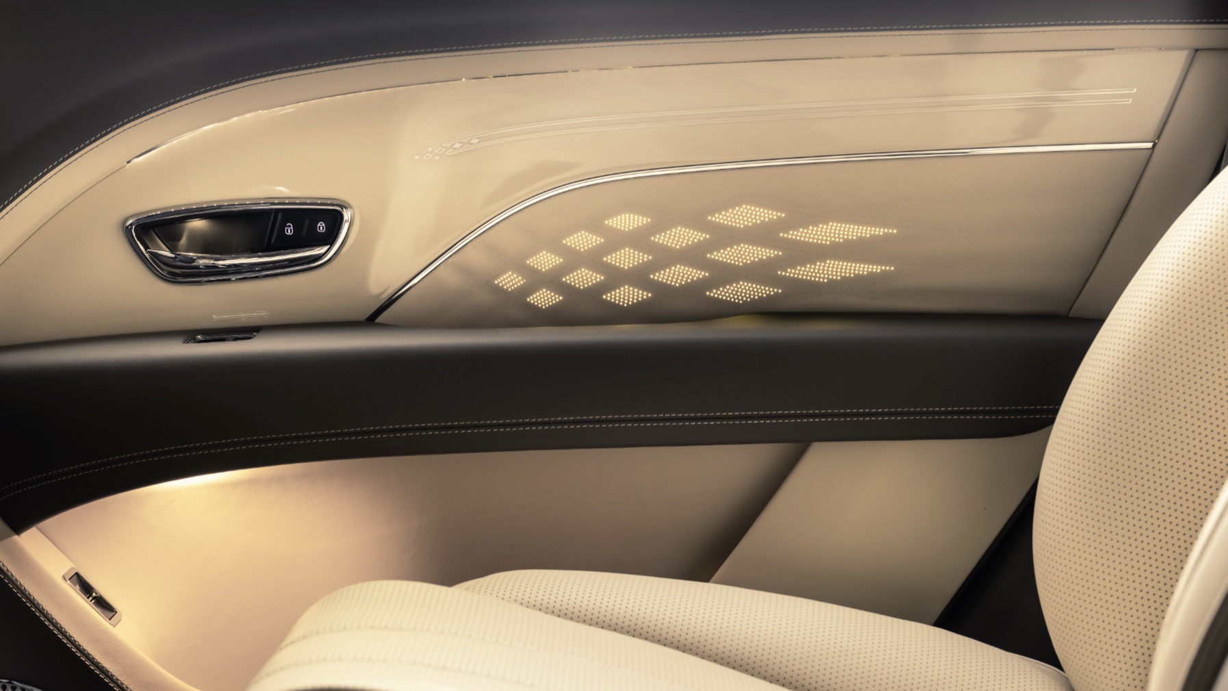 Cream leather Bentley door panel with an illuminated diamond pattern and soft ambient cabin light